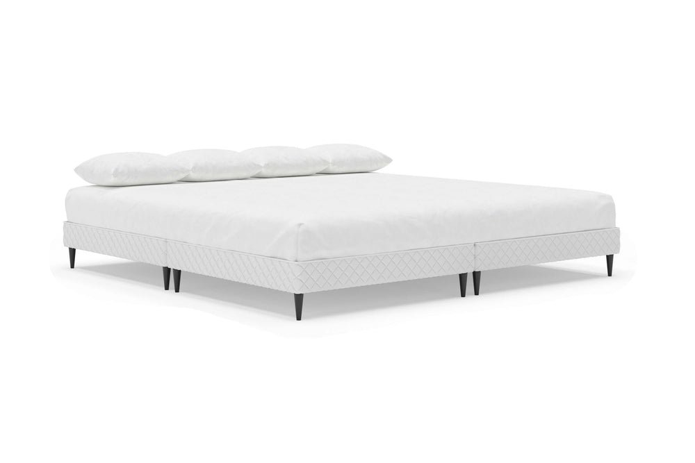 Angled view of platform bed frame with a mattress